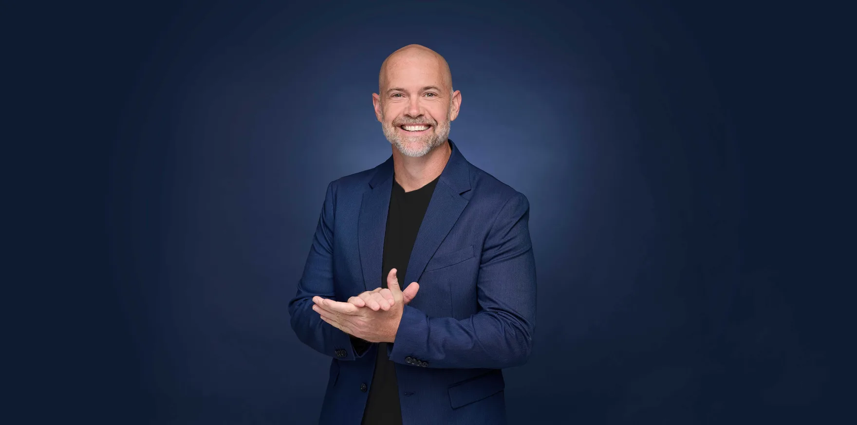 Bronkar Lee smiling in a studio portrait
